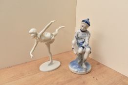 A late 20th century West German Kaiser bisque porcelain ice skater figurine, modelled balancing on