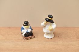 Two Coalport porcelain Paddington Bear figures comprising 'Goes Sledging' and 'With Marmalade', both