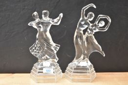 A pair of vintage crystal glass ballroom dancer studies, measuring 25cm and 27cm.