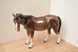 A large Melba Ware porcelain horse in brown gloss finish, measuring 30cm tall.