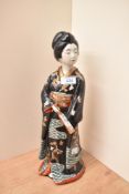 A large oriental Kutani style figurine, measuring 38cm tall with no visible marking or signature.