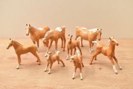 Eight Beswick Pottery Palomino horses and foals, all in gloss finish.