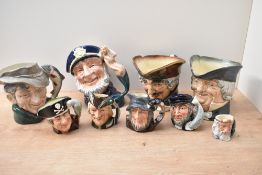 A group of nine Royal Doulton bone china character jugs including 'Old Salt' D6551, 'Capt Ahab'