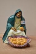 Royal Doulton bone china 'An Orange Vendor' figurine, model number HN 72, designed circa 1917,