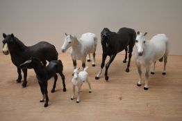 Twelve Royal Doulton bone china and Beswick Pottery horses and foals, both matt and gloss finish