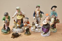A pair of 19th century Sitzendorf porcelain figures, modelled as figures feeding chickens and decor