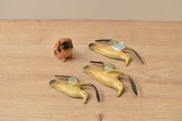 A Royal Doulton bone china small Pikenese dog study sold alongside three amateur seagull wall