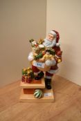 A Royal Doulton bone china limited edition Holiday Traditions series 'Rooftop Santa' figurine, model