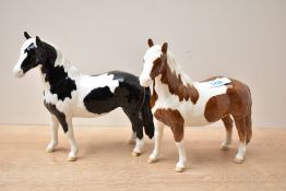 A Beswick Pottery Piebald Pinto Pony sold alongside a Beswick Pottery Skewbald Pinto Pony both model