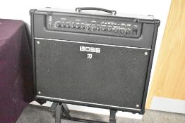 A Boss Katana Artist 100Watt 1 x 12 amplifier , sold with amp stand