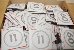 A large selection of Fender electric guitar strings, various gauges and types