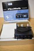 A boxed Alesis Picoverb compact effects unit