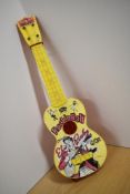 A vintage novelty plastic toy guitar, being Elvis Presley Gitar by Selcol