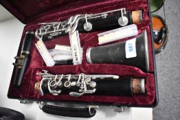 A traditional clarinet , stamped LeFleur, with fitted case and accessories