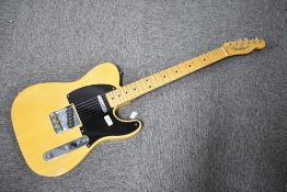 A Fender 52 reissue Telecaster electric guitar in butterscotch blonde finish, with yellow tweed hard