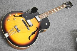 An Aria FA70 electric jazz guitar, left handed, serial number 106050407, sold with soft Warwick