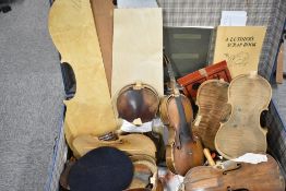 A vintage trunk containing violin and cello parts etc including luthiers tools, reference books,