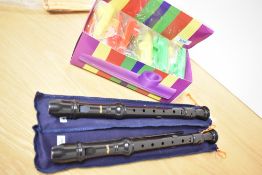 A box of plastic Kazoos and two Aulos 303A recorders
