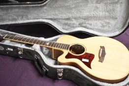 An as new Tanglewood electro acoustic guitar, model TW145 SS CE (left handed) , with fitted case ,