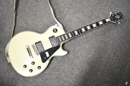 A 2012 Les Paul Custom electric guitar , serial number 120620479 (volume and tone knobs