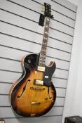 A Vintage VSA-575-TS hollow body archtop electric guitar