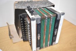 A vintage Ludwig button accordion/melodeon, box in disrepair