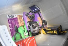 A box of assorted wall guitar hangers including Hercules and Kinsman