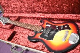 A late 60s Japanese electric guitar 'merlin', sold with fitted Selmer case