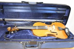 A traditional violin and bow in fitted foam case, unlabelled