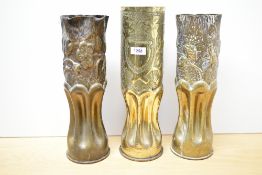 A pair of American World War II 105mm Type 1 M14 brass Trench Art Howitzer shell cases, with