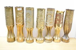 A group of seven near matching French World War I 75DEC brass Trench Art shell cases, each with