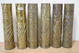 Three pairs of good World War One French brass Trench Art shell cases, the first embossed with