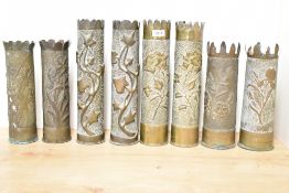 Four pairs of World War I Trench Art shell cases, each with repousse foliate detail and shaped petal