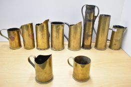 A group of British, French and American World War I and World War II adapted brass shell cases,