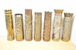 A group of six French 75DEC and one British 18 pounder World War I brass trench Art Shell cases,