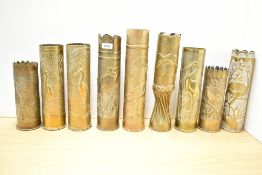 A group of nine Continental World War I brass Trench Art shell cases, mainly French 75DEC, each with