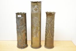 A group of three continental World War I brass Trench Art shell cases, one with flared and ruffled
