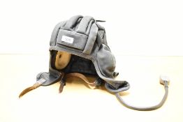 A Soviet/Russian Cold War period Tsh-4 Tankers helmet/headset, printed marks to rear fold, dated