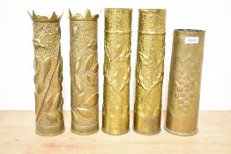 Two pairs of decorative World War I brass Trench Art shell cases, each with embossed floral