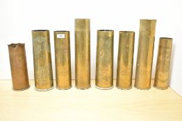 A group of eight British and French World War I brass Trench Art shell cases, each hand engraved
