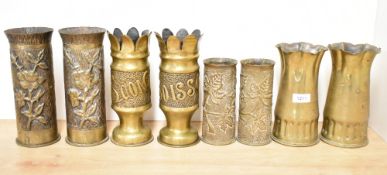 Four pairs of good World War I brass Trench Art shell cases, each with embossed foliate designs,