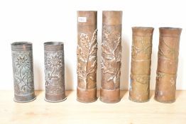 Three pairs of French and German World War I Trench Art shell cases, each hand-embossed in relief