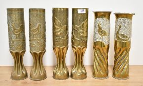Three pairs of World War I brass Trench Art shell cases, each with deep moulded fluting and embossed