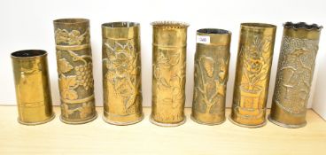A group of seven French, British and German World War I brass Trench Art shell cases, six embossed