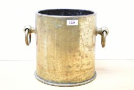 A large German World War I Polte Madgeburg 1917 235mm brass shell case, with ring handles and