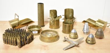 A selection of mixed World War I and II adapted brass trench art shell cases, ashtrays, scuttles,