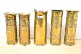 A pair of World War I brass Trench Art shell cases, having flated and ruffled rim over an oak leaf