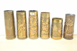 A group of six French and German World War I and earlier brass Trench Art shell cases, embossed