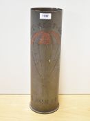 An American World War II 105mm M14 (Howitzer) Trench Art shell case, engraved with a depiction of