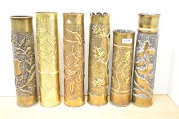 A group of six French World War I brass Trench Art shell cases, embossed and hand-worked foliate